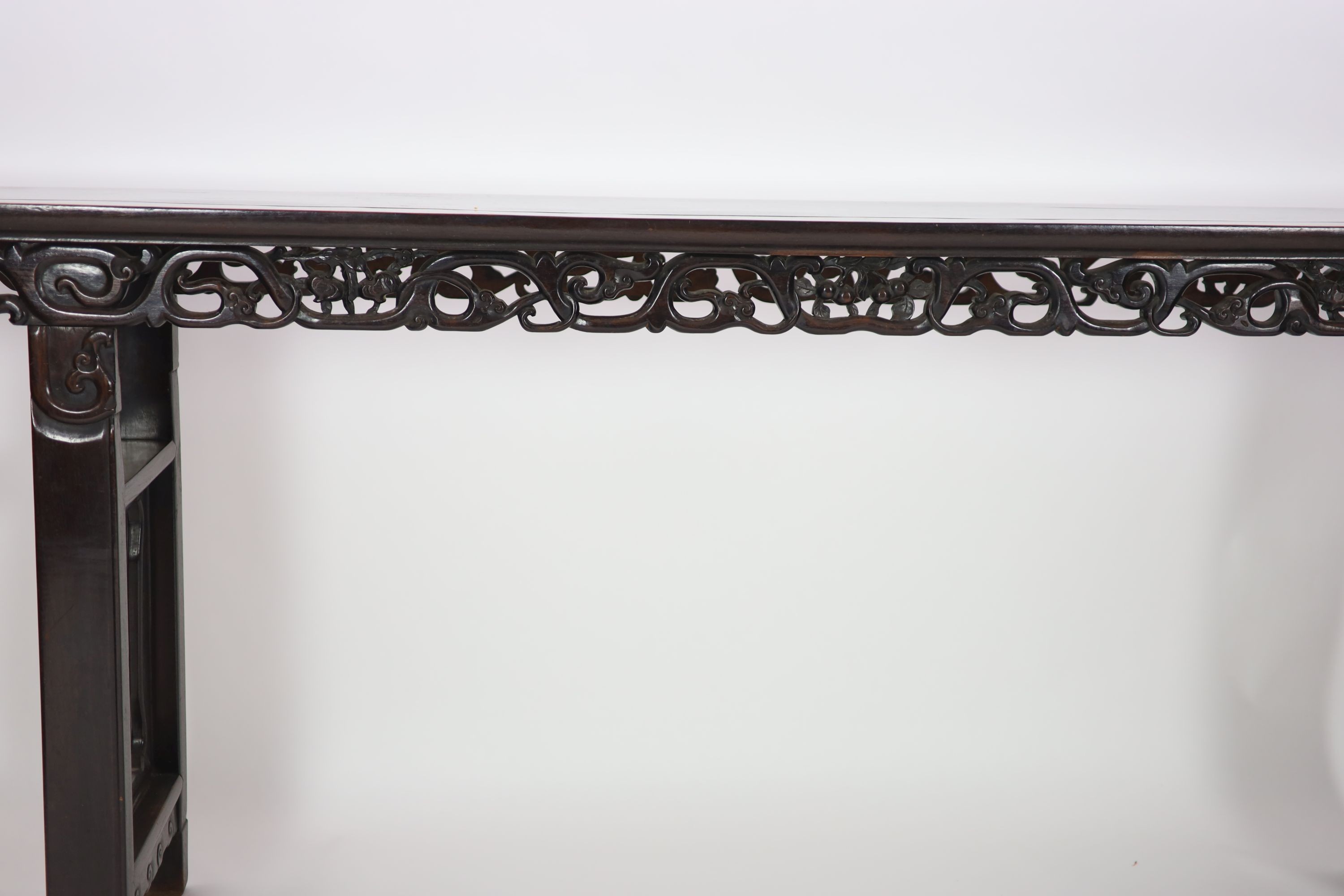 A large Chinese hongmu altar table, 19th century H 110cm. W 281cm. D 51.5cm.